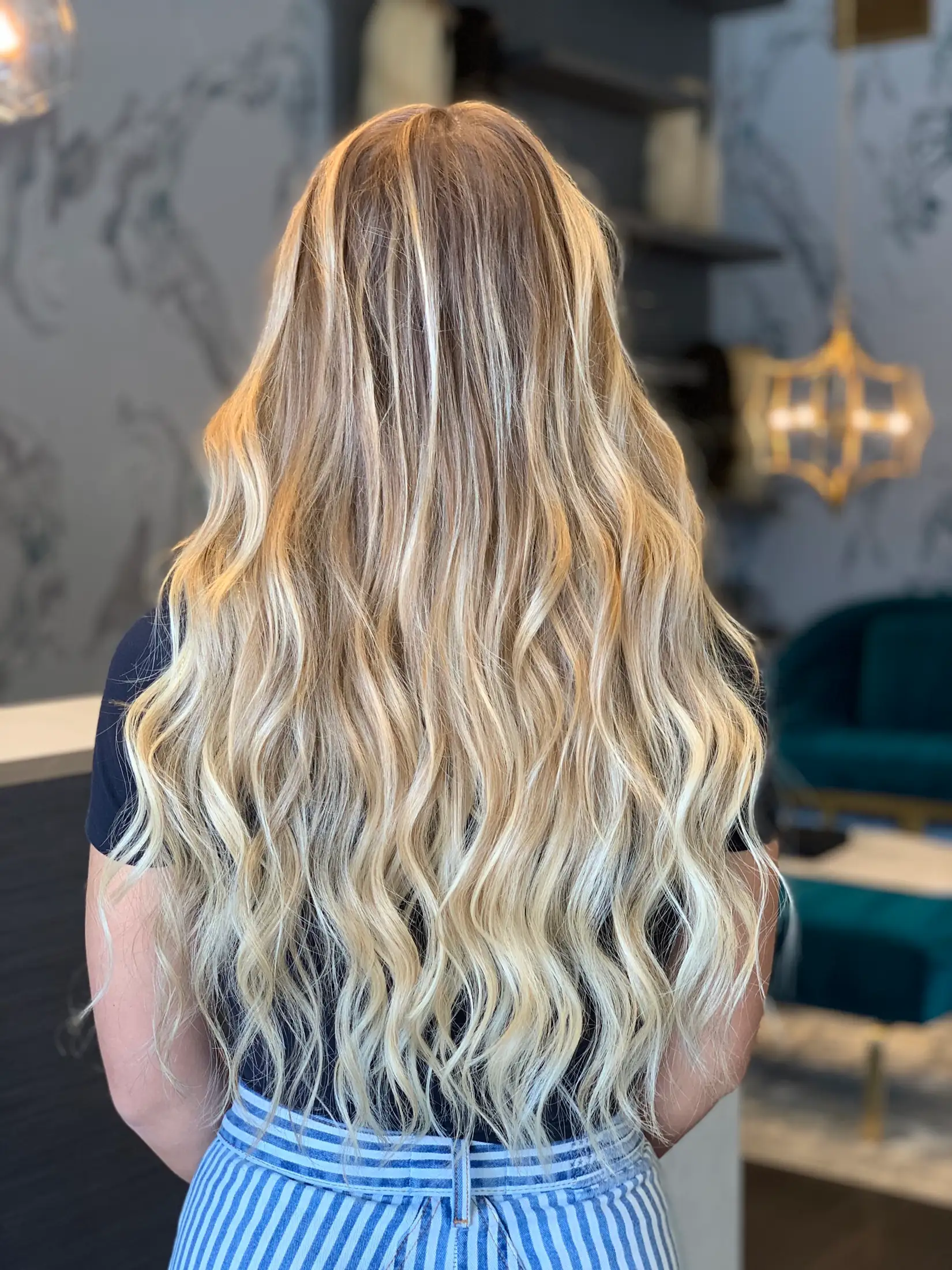 Full-length hair extensions installed in Boca Raton, photographed from behind in the studio